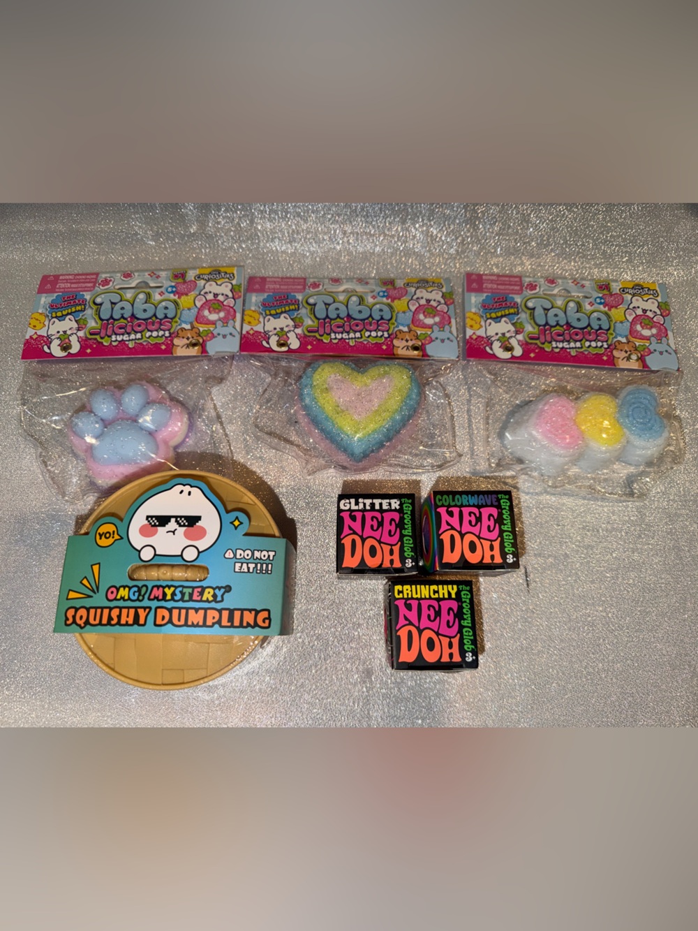 1 NeeDoh  Ball, 1 Omg Mystery Dumpling & 1 Orb Curiosities Sugar Pops